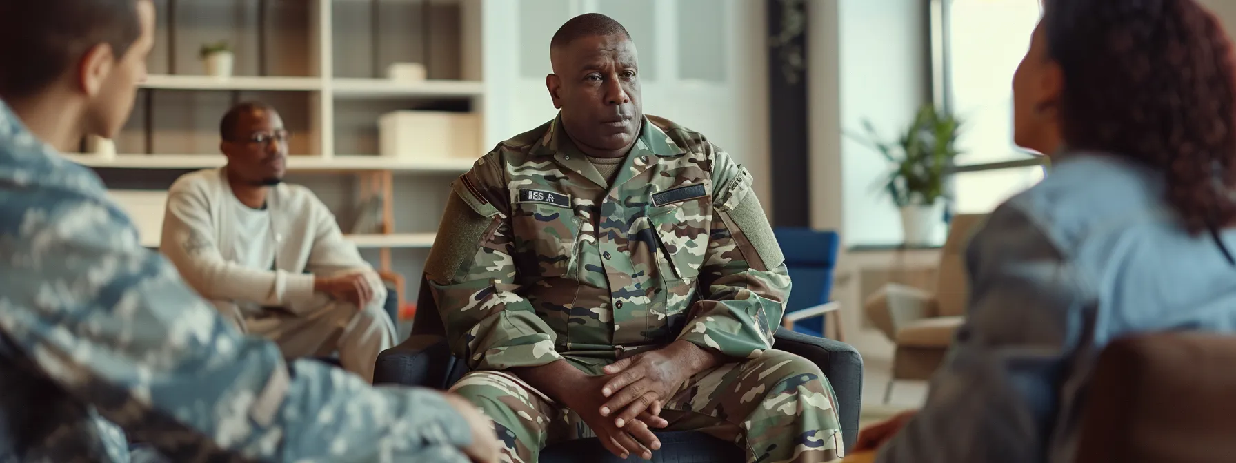 a focused support group meeting in a modern, well-lit office space, featuring veterans engaged in deep conversation, surrounded by calming elements and inspirational quotes, embodying the themes of healing, connection, and emotional strength in combating ptsd.