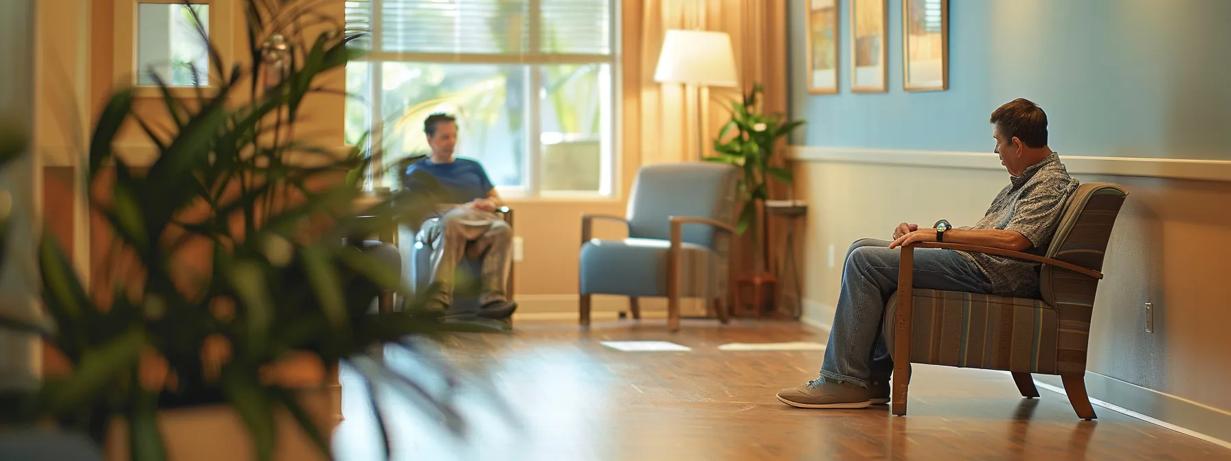 a serene, warmly lit therapy room with a lone veteran seated in a comfortable chair, thoughtfully engaging in conversation with a compassionate mental health professional, symbolizing hope and recovery in trauma-informed care.